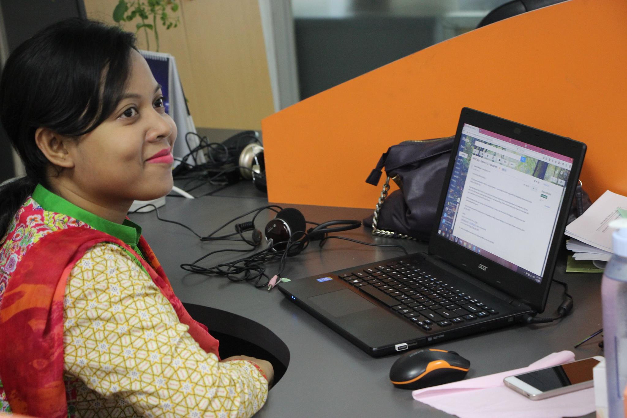 Nusrat Jahan working on a laptop